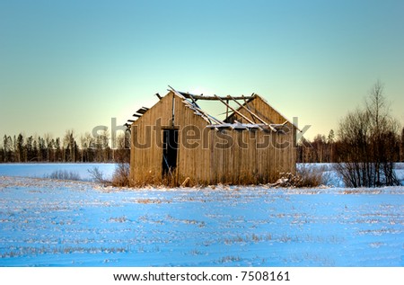 old traditional barn in a winter scenery