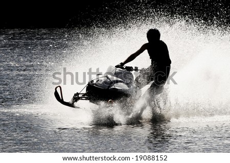 Snowmobile driven fast on open water