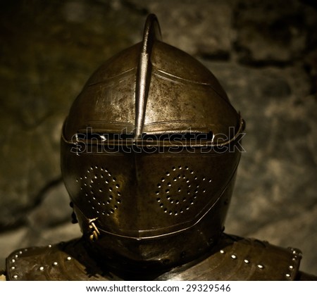 a medieval knight helmet of shining metal