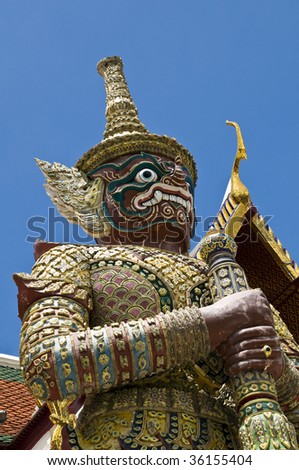 Guardian statue at the temple Wat phra kaeo in the Grand palace area, one of the major tourism attraction in Bangkok, Thailand