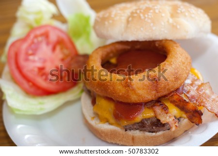 Bacon Cheeseburger with Onion Ring on Sesame Seed Bun