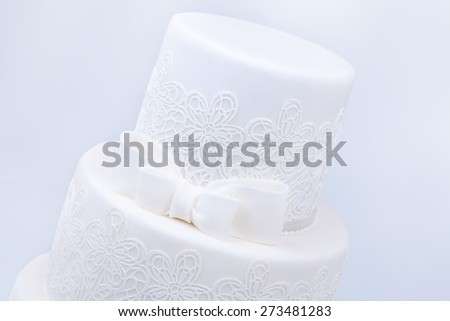 Delicious luxury ping wedding or birthday cake with golden decoration