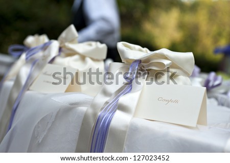 wedding table with bags of confetti