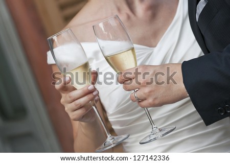 bride and groom at their wedding toast