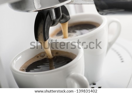 close up of coffee machine makes two coffee