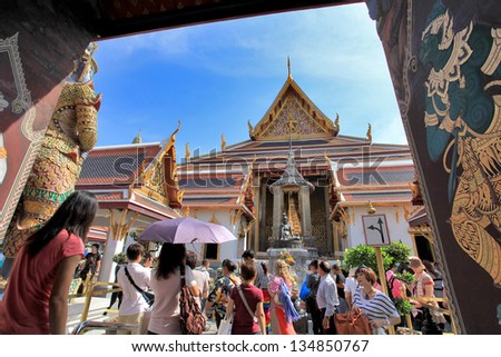 BANGKOK THAILAND - JAN 03 : Many people go to the Grand Palace  (also called Wat Phra Kaew) on January 03, 2013 in Bangkok, Thailand.