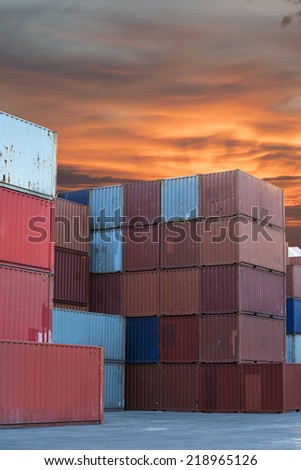 Stacked cargo containers in import export logistic area of freight sea port terminal
