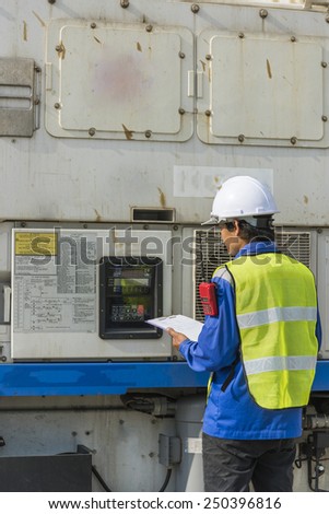 transportation engineer checking reefer container box in logistic zone