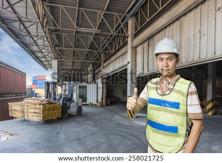 worker with forklift handling the Pallet wood in a warehouse