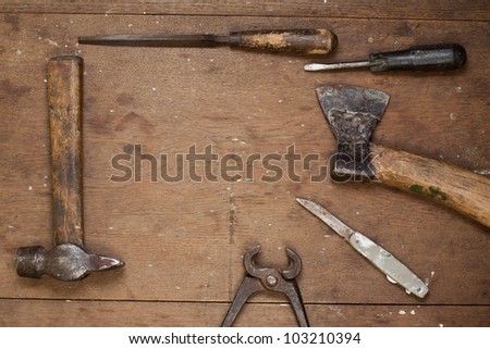 Vintage work tools on grunge wood