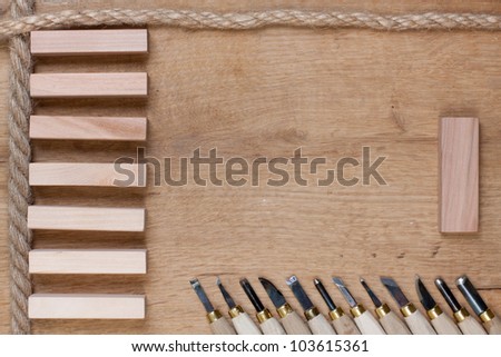 Wood carving tools with empty planks and rope