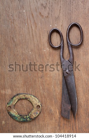 Old scissors on wood