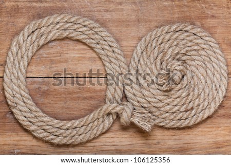 Rope frame on old wood texture