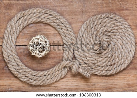 Rope frame on old oak wood textured background