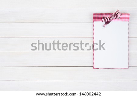 Notebook on white wood background