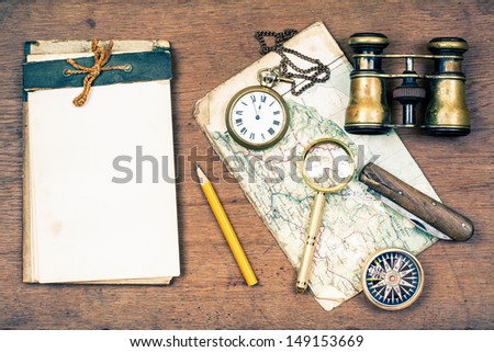 Old Notebook, Compass, Map, Vintage Binoculars, Pencil, Pocket Watches, Knife, Magnifying Glass On Wooden Background