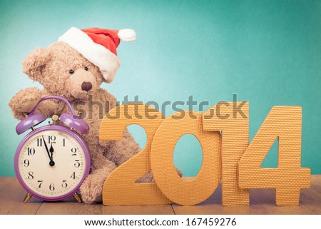 New Year date, retro clock, Teddy Bear in Santa hat for greeting card background