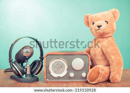 Retro radio, microphone with headphones and Teddy Bear front mint green background