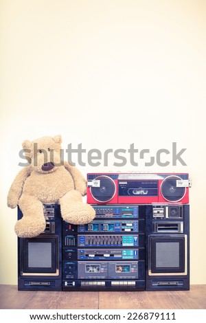 Teddy Bear with retro radio cassette recorders. Very big ghetto blaster with karaoke from 80s