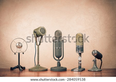 Retro old microphones for press conference. Vintage instagram style filtered photo