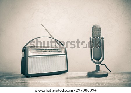 Retro sudio microphone and old radio receiver from 60s. Vintage style sepia photo