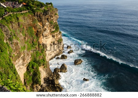 High Cliff at Uluwatu Temple, Bali, Indonesia - A scenic Uluwatu Cliff with pavilion and blue sea in Bali Indonesia.