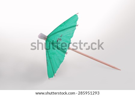 Green Cocktail Umbrella Isolated on White Background