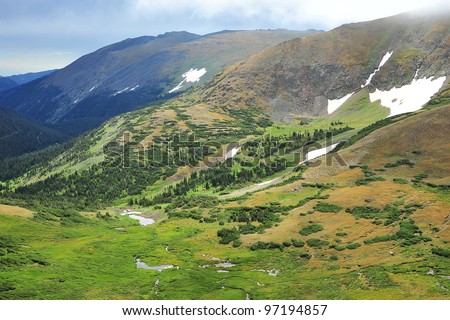 Ice patches remaining in mid-summer, Rocky Mountain National Park is a national park located in the north-central region of the U.S. state of Colorado