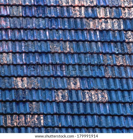 Closeup of old and damaged roof tiles