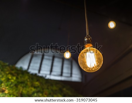 Vintage hanging lamp with factory window background decorate for loft style