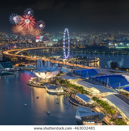 Singapore city skyline aerial with firework view during twilight time in Singapore National day