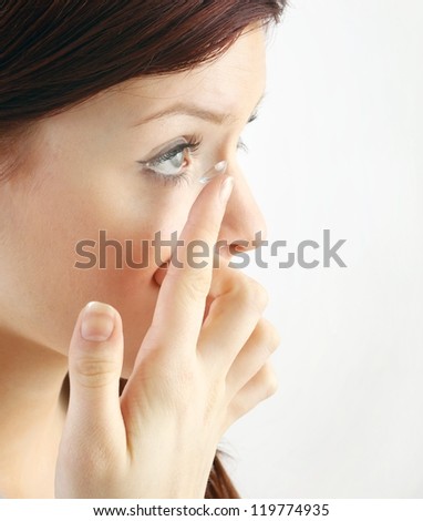 young woman with contact lens