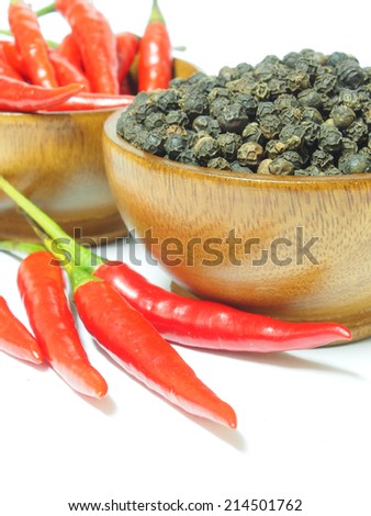Red chili pepper and black pepper spicy isolated on white background