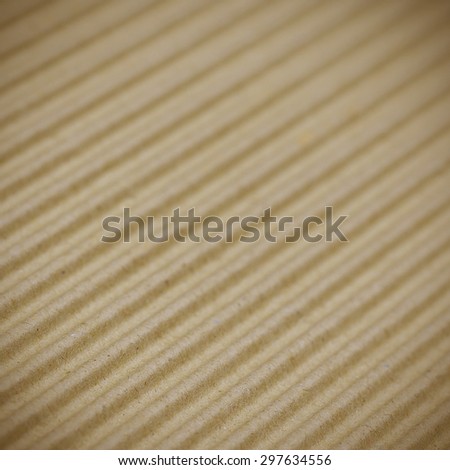 Brown corrugated cardboard background selective focus