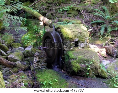 Moss covered powerhouse and water wheel