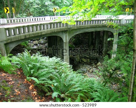 Old curved bridge over Oyster Creek along world famous Chuckanut Drive in Washington state, USA