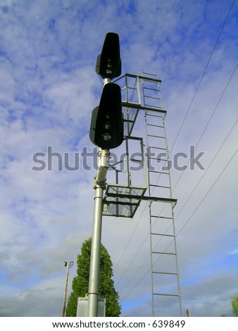 Traffic control signal along railroad tracks