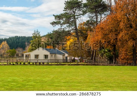 Farm house in rural Hawkes Bay, New Zealand, with autumn colour