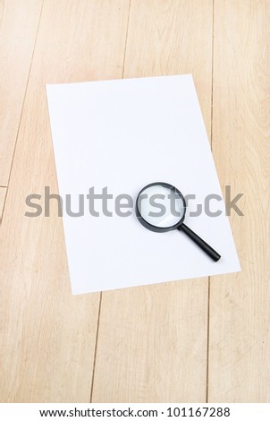 A4 paper and magnifier
