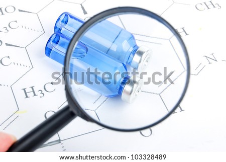 Magnifier and medicine on chemical formula