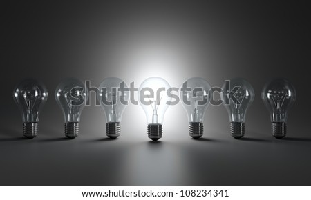 Grayscale image of light bulbs in a row