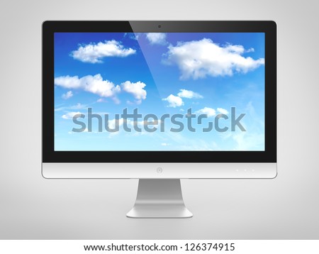 Computer monitor with cloudy sky image on screen. Cloud computing concept.