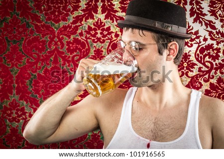 White man with glasses, hat, wife beater, brown hair chugging light beer alone in retro red and gold background bar