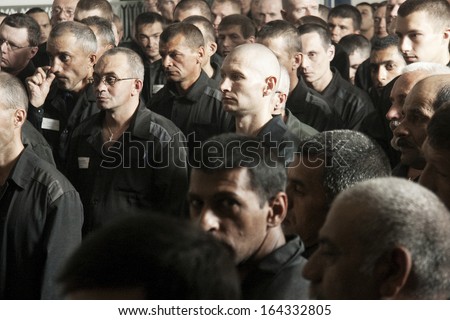 Novosibirsk, Russia - August 29: Men\'S Common Jail. The Prisoners Stand In The Dining Room And Listen To Orthodox Priest, August 29, 2011 In Novosibirsk, Russia