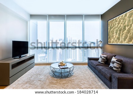 living room with big window and TV interior