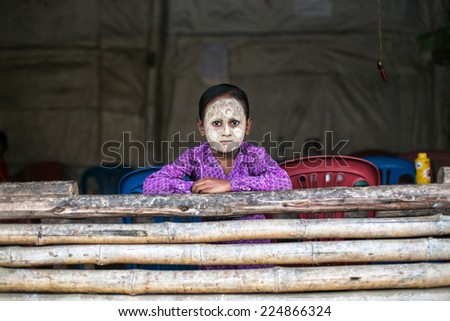MAELA, MAESOT/THAILAND - JULY 12, 20114: Unknown Karen girl setting in the house in refugee camp in Thailand