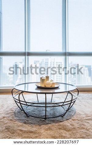 Table in living room with big window