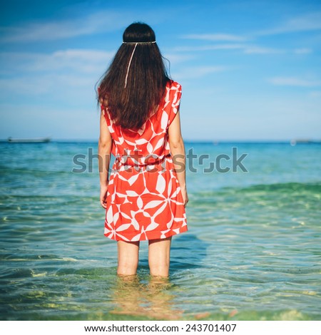 Waiting future relax concept. Beautiful girl on the sea