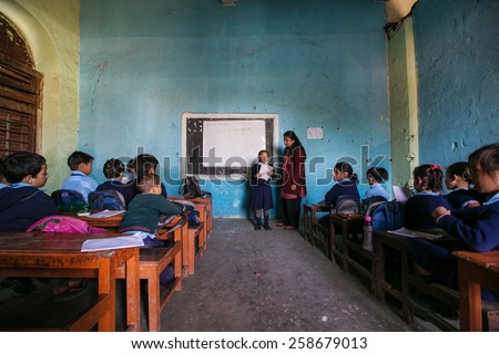 KATHMANDU, NEPAL - DECEMBER 7, 2014: The girl in the classroom lesson in the oldest school of Nepal Durbar High School