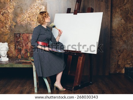 painter woman with blank canvas